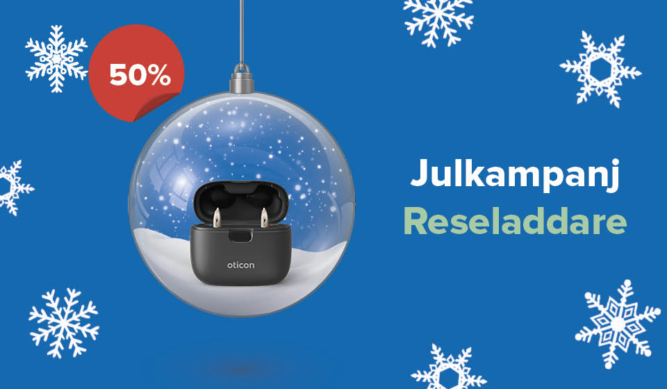 Bild på en julkula som innehåller en reseladdare till hörapparater som du kan köpa på 50% hos Audika och hörselbutik.se