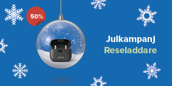 Bild på en reseladdare till hörapprater som ligger i en julkula som kund kan köpa på rabatt hos Audika.se eller i hörselbutik.se