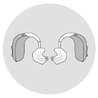 Bild på två bakom-örat-hörapparater med insatser