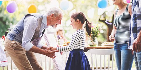 Image show grand dad give girl a birthday present