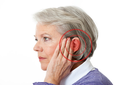 earwax build up or tinnitus woman holding ear