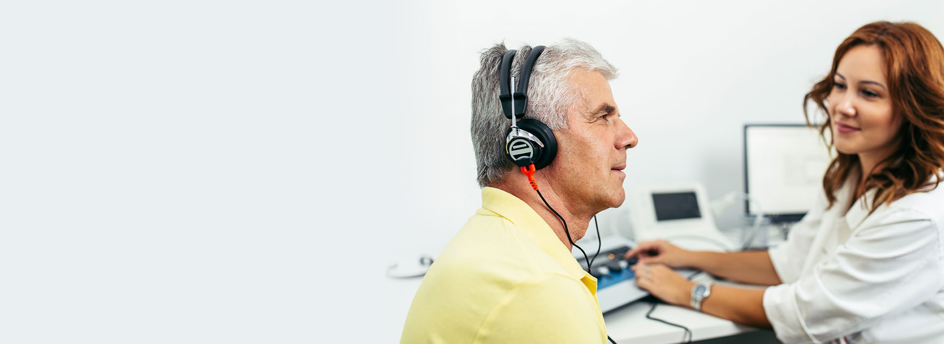 man hearing test and audiologist