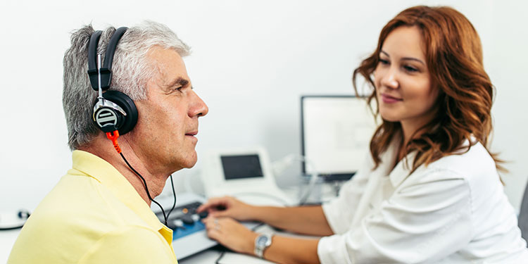 man hearing test and audiologist