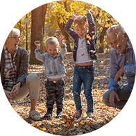 image shows family playing during autumn