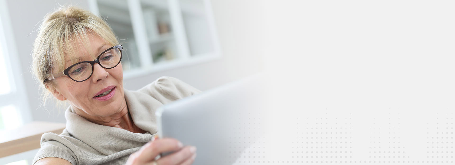 Image shows man talking on the phone sitting on the sofa