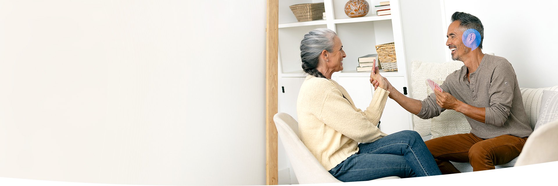 A couple chatting with the man's ear highlighted