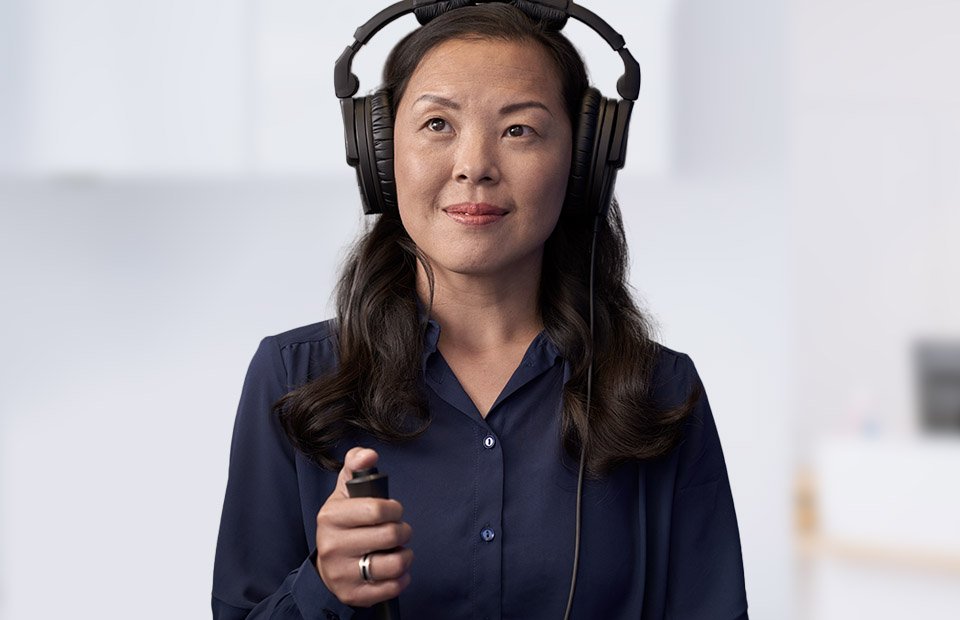 Image shows woman during hearing test