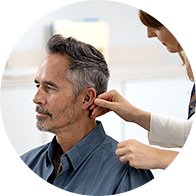 A man getting a hearing aid fitted