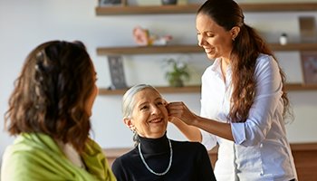 lady getting a hearing aid fitted