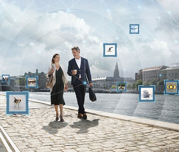 Image shows couple walking by the harbour with sounds highlighted around them