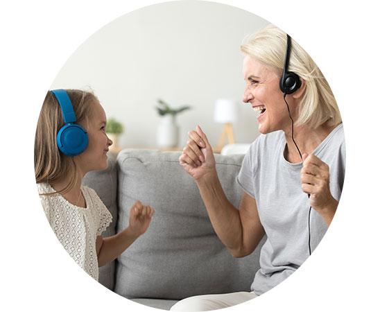 mom and daughter smiling with earphones