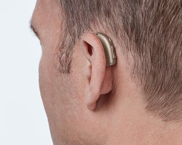 Afbeelding van hoorapparaten achter het oor